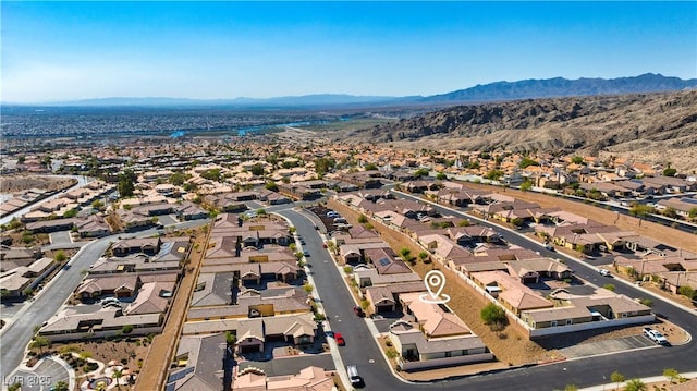 birds eye view of property featuring a mountain view and a residential view