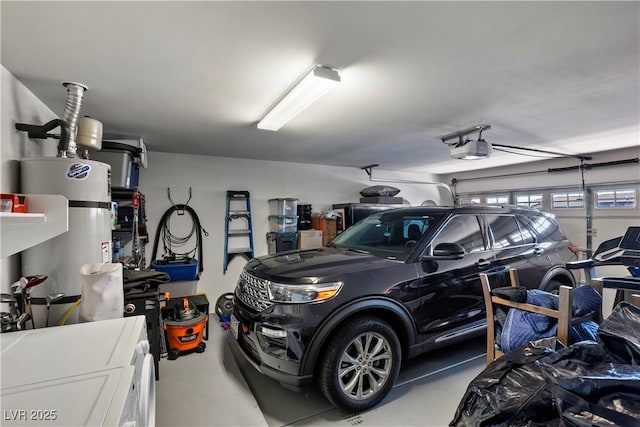 garage featuring a garage door opener and water heater