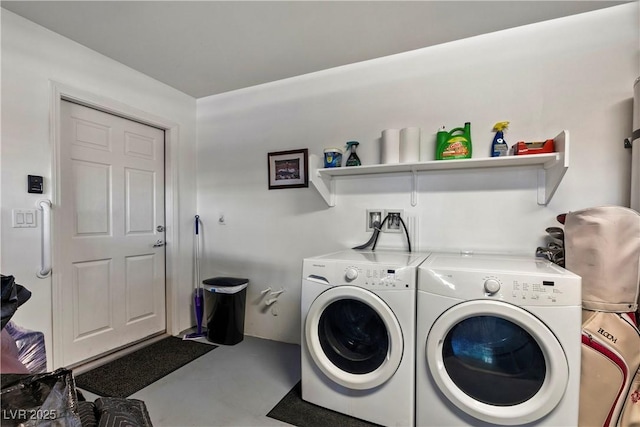 washroom featuring laundry area and separate washer and dryer