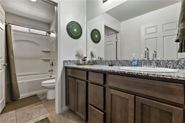 bathroom featuring toilet, washtub / shower combination, and vanity