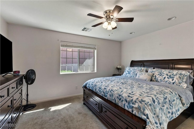 bedroom featuring light carpet, a ceiling fan, visible vents, and baseboards