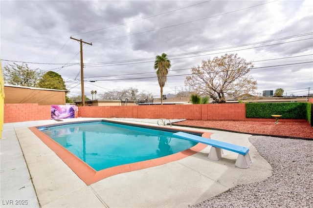 view of swimming pool with a patio, a fenced backyard, and a fenced in pool