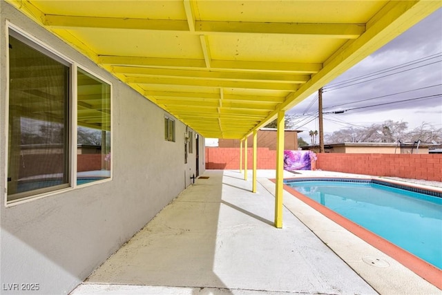 view of pool with a fenced backyard, a fenced in pool, and a patio area
