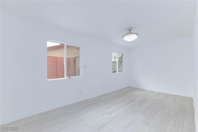 spare room featuring light wood-style flooring