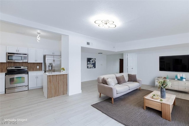 living area with light wood-style floors