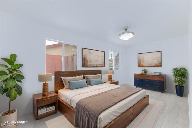 bedroom with multiple windows