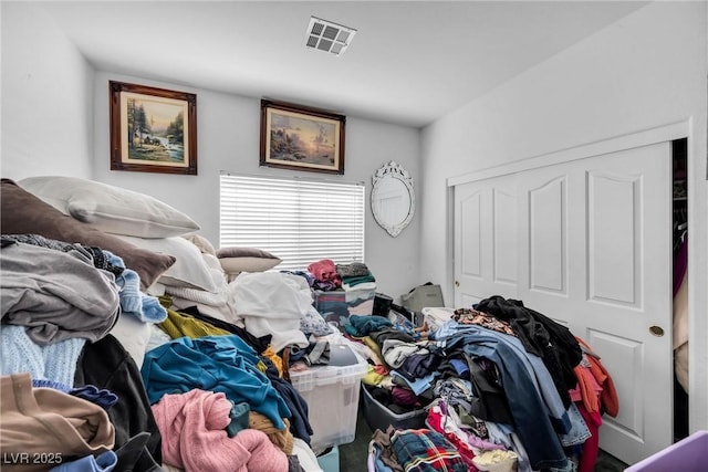 bedroom featuring visible vents and a closet