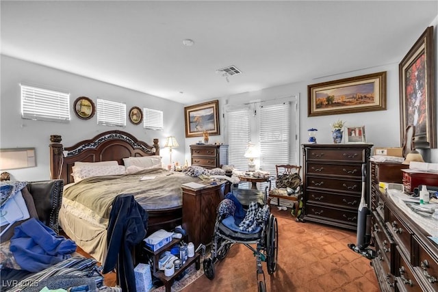 bedroom featuring visible vents