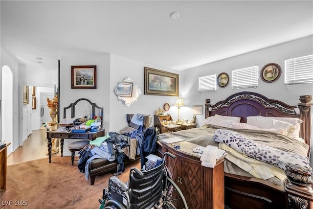 bedroom with arched walkways