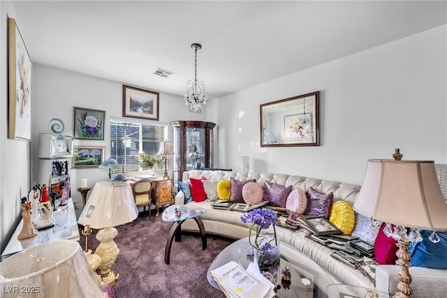 carpeted living area featuring visible vents and an inviting chandelier