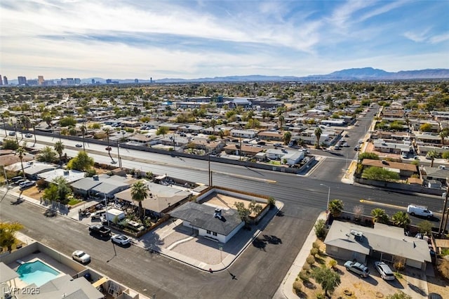 birds eye view of property featuring a mountain view