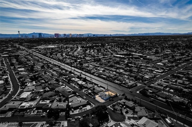 birds eye view of property with a mountain view