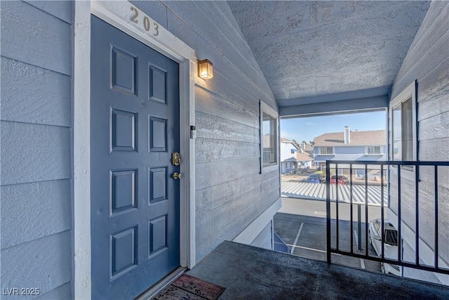 property entrance featuring a balcony