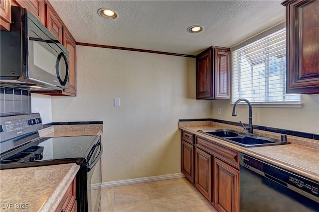 kitchen featuring a textured ceiling, a sink, baseboards, light countertops, and black appliances