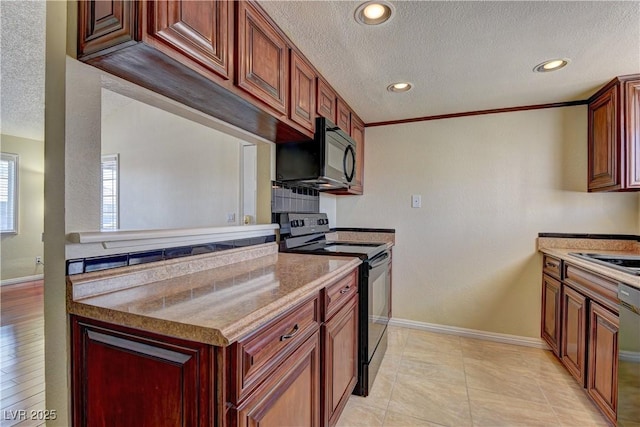 kitchen with recessed lighting, baseboards, a textured ceiling, and black appliances