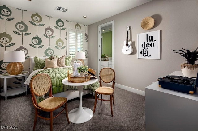 carpeted dining room featuring visible vents and baseboards