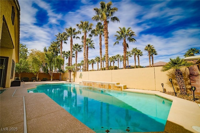 view of swimming pool featuring a fenced in pool and a fenced backyard