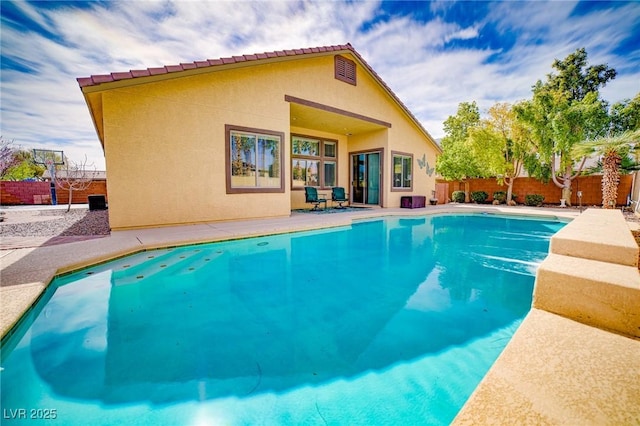 view of pool with a patio area, fence, and a fenced in pool