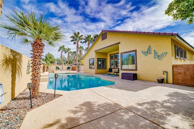 view of pool with a fenced backyard, a fenced in pool, and a patio