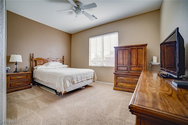 bedroom featuring light colored carpet, ceiling fan, and visible vents