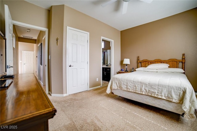 bedroom with ceiling fan, connected bathroom, light colored carpet, visible vents, and baseboards