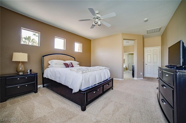 bedroom featuring a ceiling fan, visible vents, light carpet, and baseboards