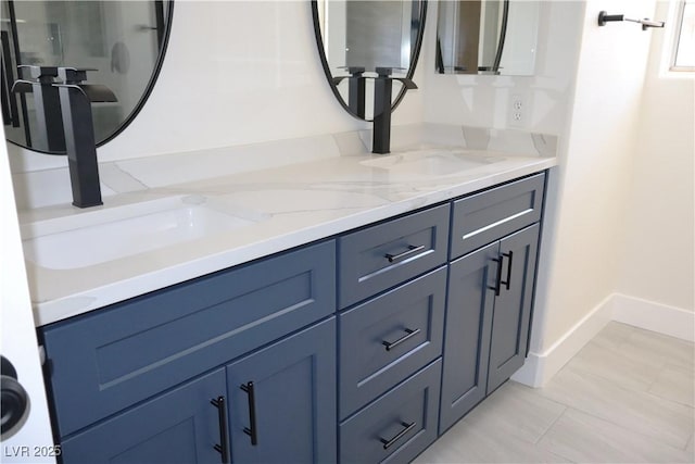 1624 N Torrey Pines Dr Unit 101, Las Vegas, NV 89108 - bathroom featuring double vanity and baseboards