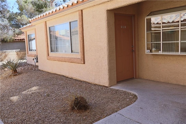 1624 N Torrey Pines Dr Unit 101, Las Vegas, NV 89108 - property entrance with stucco siding and a tile roof