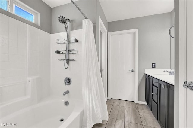 bathroom featuring shower / tub combo and vanity