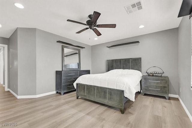 bedroom with light wood-style flooring, visible vents, baseboards, and recessed lighting