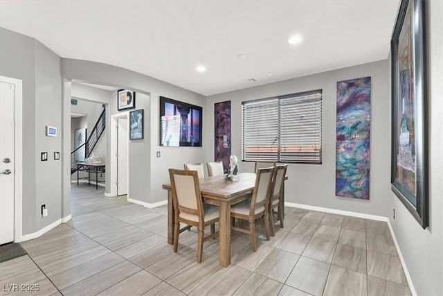 dining space with recessed lighting and baseboards