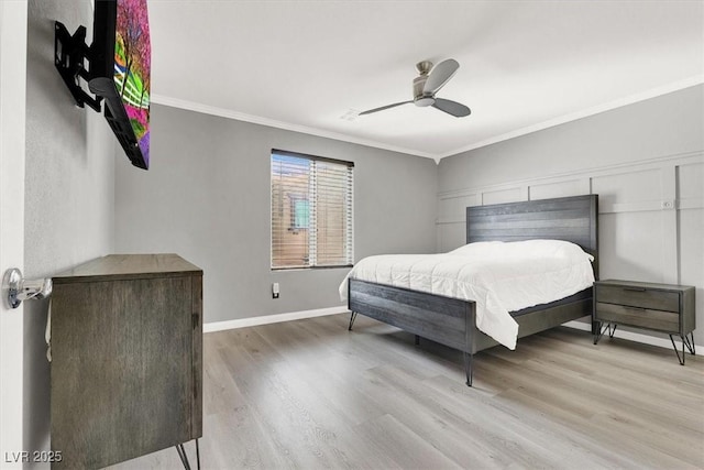 bedroom featuring ceiling fan, ornamental molding, wood finished floors, and baseboards