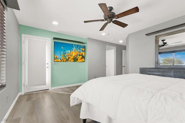 bedroom with ceiling fan, recessed lighting, wood finished floors, and baseboards