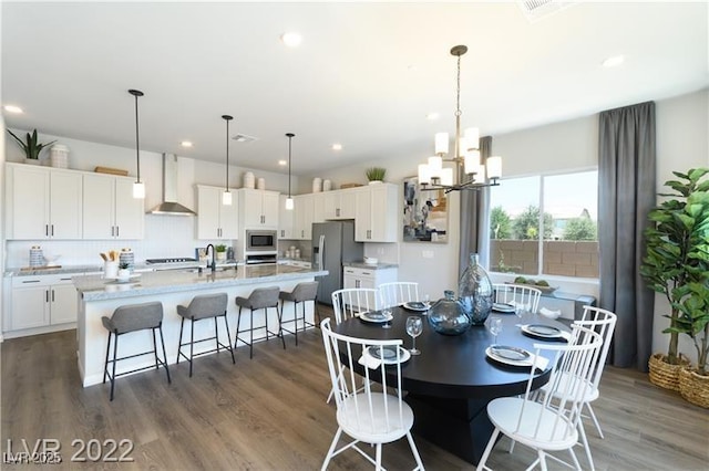 6324 Zephyr Ct, Las Vegas, NV 89149 - dining area with an inviting chandelier, dark wood-style flooring, and recessed lighting