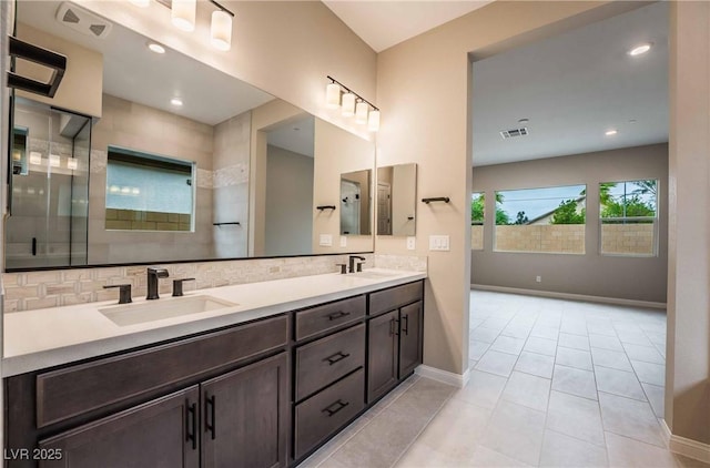 6324 Zephyr Ct, Las Vegas, NV 89149 - full bath with a sink, baseboards, backsplash, and visible vents