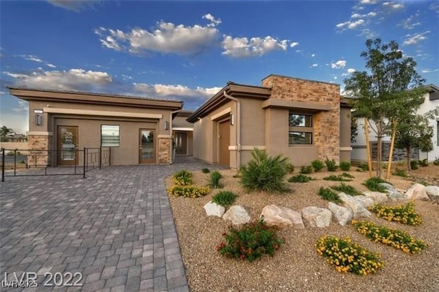 6324 Zephyr Ct, Las Vegas, NV 89149 - view of front facade featuring stone siding, stucco siding, and fence