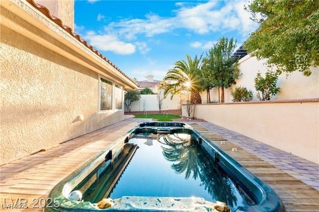 view of pool featuring fence private yard