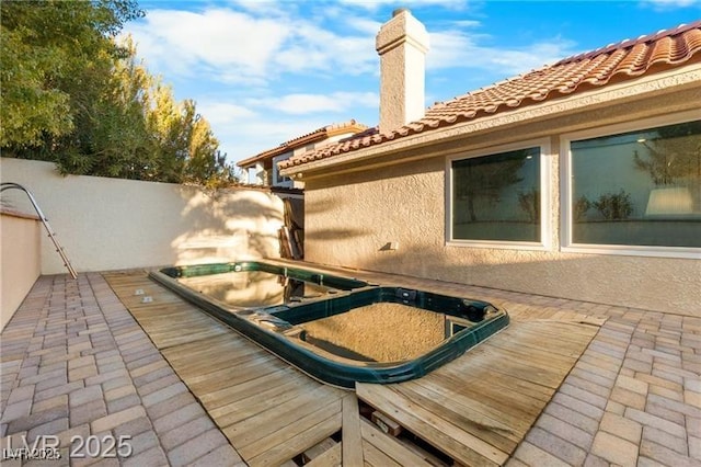 view of swimming pool with fence