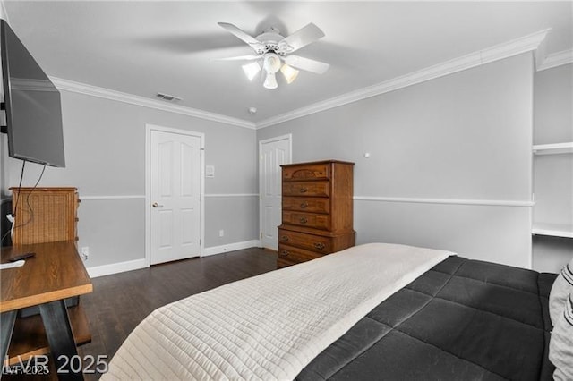 bedroom with crown molding, visible vents, a ceiling fan, wood finished floors, and baseboards