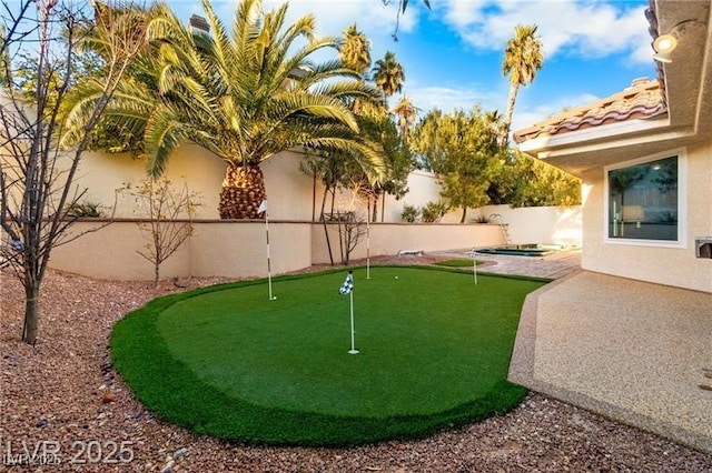 view of yard featuring a patio area and a fenced backyard