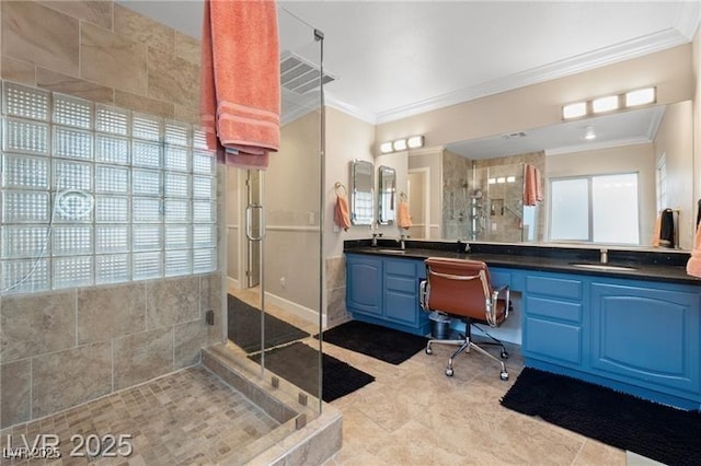 bathroom featuring a stall shower, vanity, visible vents, and crown molding