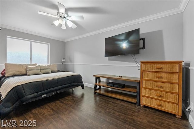 bedroom with ornamental molding, a ceiling fan, baseboards, and wood finished floors