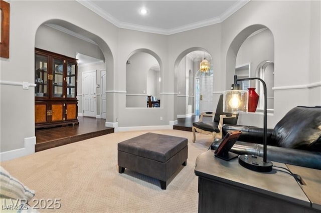 living area featuring carpet, crown molding, baseboards, and recessed lighting