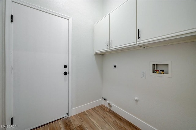 laundry room featuring cabinet space, hookup for a gas dryer, light wood-style flooring, hookup for an electric dryer, and washer hookup