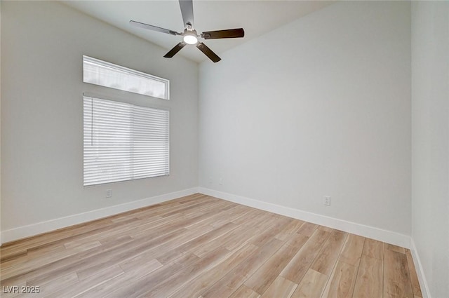 empty room with light wood-style floors and baseboards