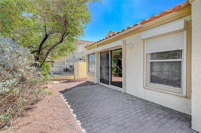 view of patio featuring fence