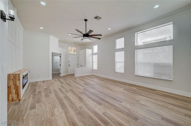 unfurnished living room featuring recessed lighting, visible vents, light wood-style flooring, and baseboards