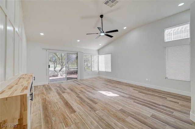 unfurnished living room featuring light wood finished floors, recessed lighting, visible vents, and baseboards