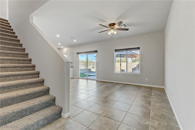 interior space with baseboards, recessed lighting, a ceiling fan, and tile patterned floors