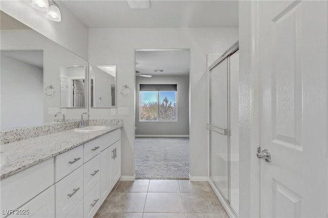 full bath with visible vents, baseboards, vanity, tile patterned floors, and a stall shower